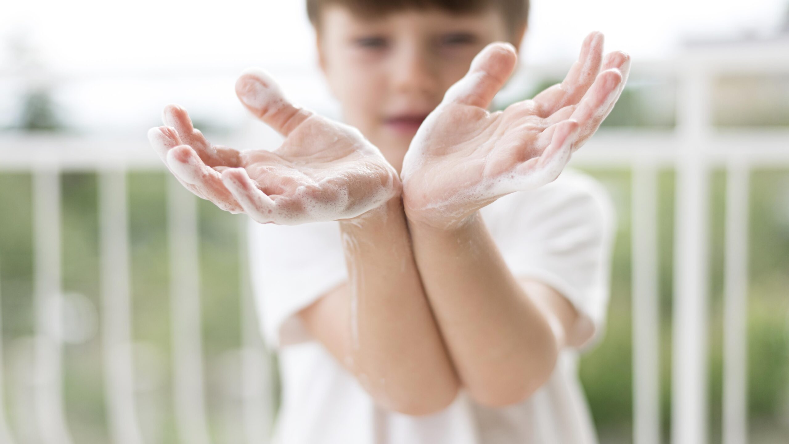 person-washing-hands-with-soap